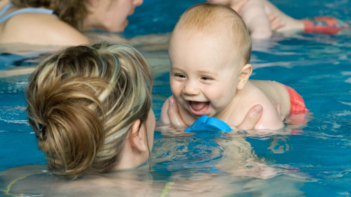 When to take your baby swimming and other questions answered Baby in as swimming pool with mother